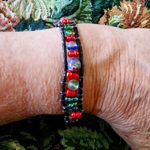 One of a kind handmade. Beaded and leather bracelet